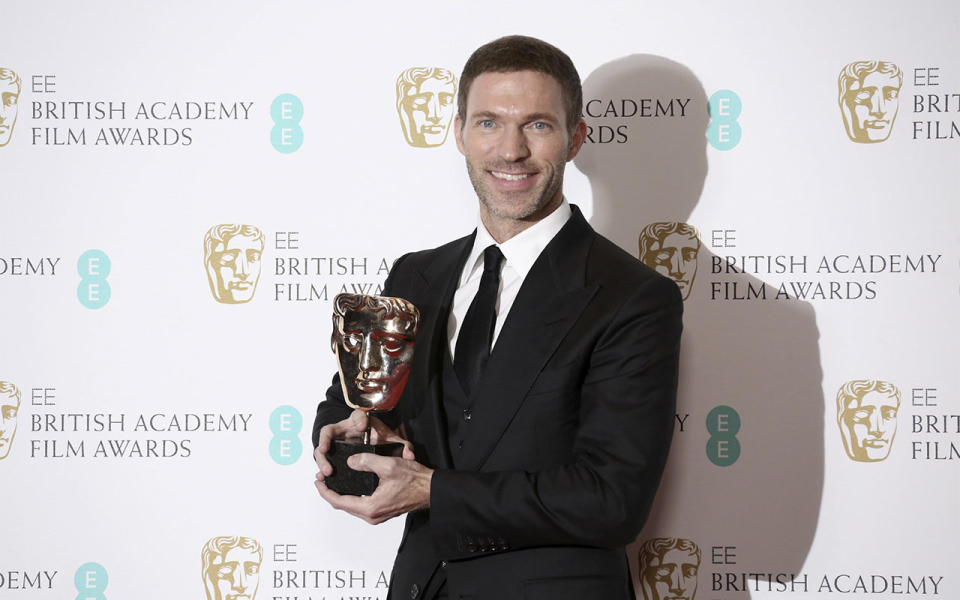 <p>Animator Travis Knight holds his BAFTA award (Credit: Joel Ryan/Invision/AP) </p>
