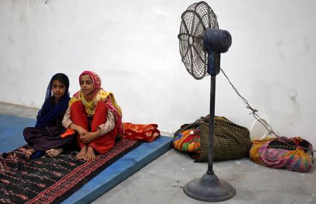 Villagers sit inside a relief camp after they evacuated their village near the border with Pakistan in Ranbir Singh Pora, southwest of Jammu, September 30, 2016. REUTERS/Mukesh Gupta