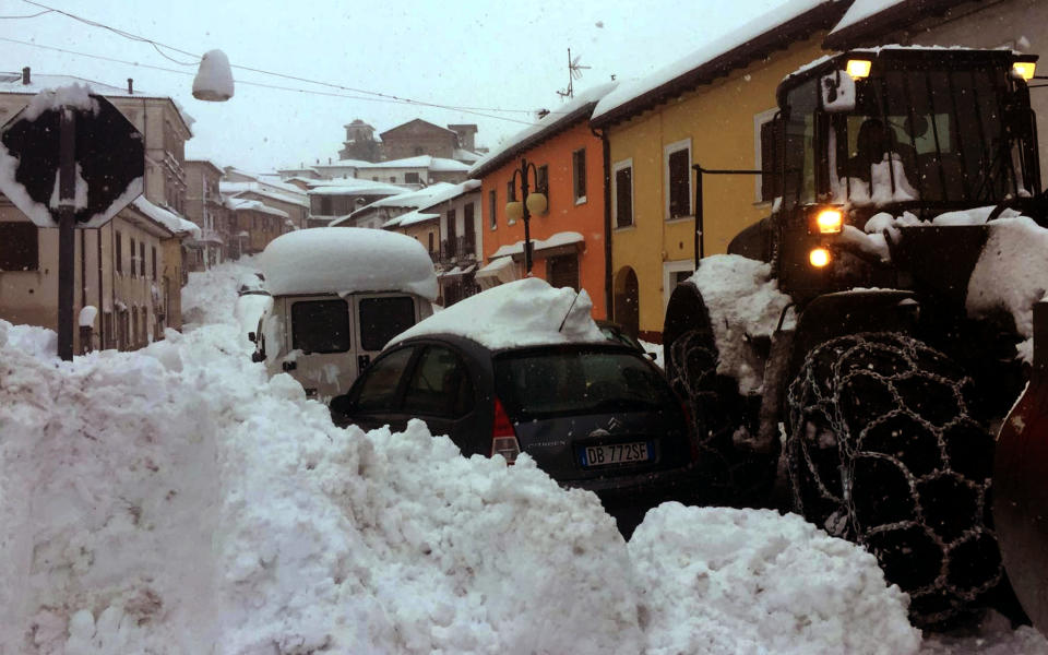 Exceptional snow clogs the roads in Montereale, central Italy, Wednesday, Jan. 18, 2017. Three strong earthquakes shook central Italy in the space of an hour Wednesday, striking the same region that suffered a series of deadly quakes last year and further isolating towns that have been buried under more than a meter (3 feet) of snow for days. The first tremor, with a preliminary magnitude of 5.3, hit Montereale at about 10:25 a.m. (0925 GMT). (Claudio Lattanzio/ANSA via AP)