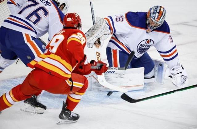 Winnipeg Jets preseason vs. Calgary Flames tonight, Connor Hellebuyck  starts in goal 