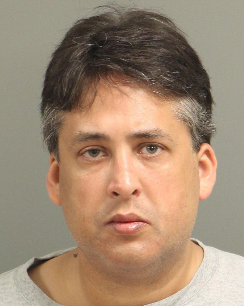 This undated photo made available by the Wake County City-County Bureau of Identification shows Brett Andrew Locklear, 50. Locklear was a former admissions director at North Carolina State University and worked to advance achievement for Native American students, according to his online resume. He pleaded guilty to federal child pornography charges in October. He was arrested in March 2022 and is awaiting sentencing as of December 2022. (Raleigh/Wake City-County Bureau of Identification via AP)