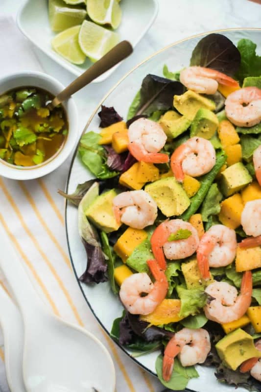 <p>Reluctant Entertainer</p><p>Celebrate spring by serving this fresh prawns mango avocado salad, drizzled with a light, tangy lime dressing! Perfect for lunch or dinner.</p><p><strong> Get the recipe: <a href="https://reluctantentertainer.com/prawns-mango-avocado-salad/" rel="nofollow noopener" target="_blank" data-ylk="slk:Prawns Mango Avocado Salad;elm:context_link;itc:0;sec:content-canvas" class="link rapid-noclick-resp"><em>Prawns Mango Avocado Salad</em></a></strong></p>