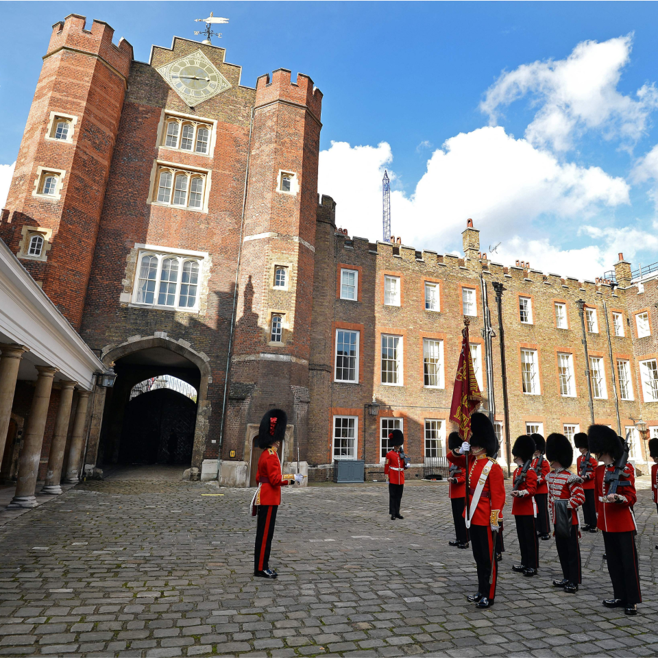  The St James's Palace detachment of The Queen's Guard turns out in Colour Court, St James Palace, for the arrival of Britain's Queen Elizabeth II, ahead of the christening of Prince George by the Archbishop of Canterbury on October 23, 2013. 