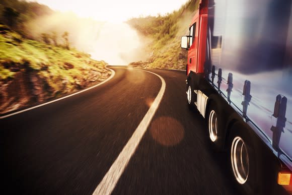 Truck driving down the highway.