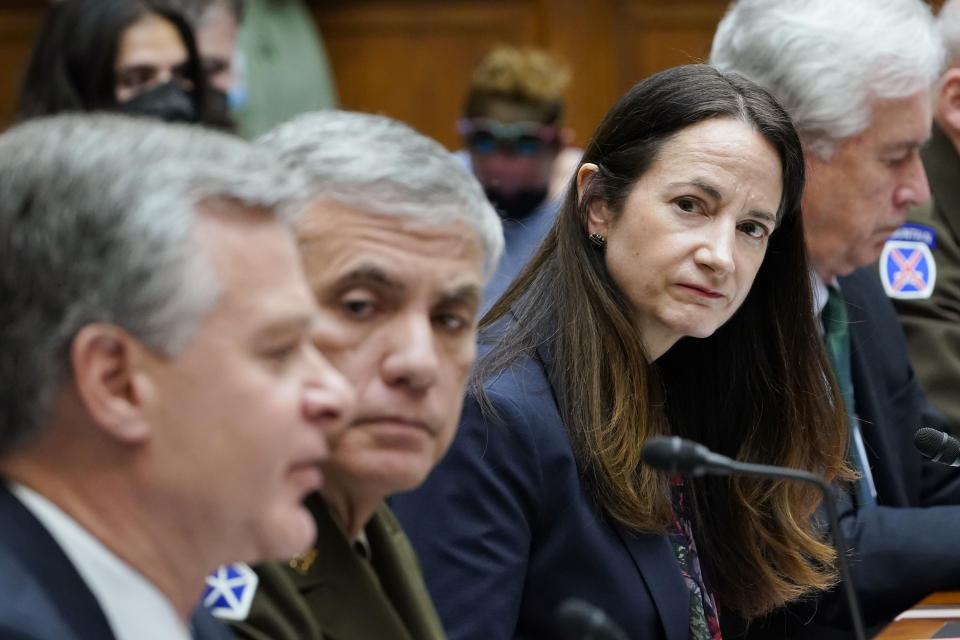 Director of National Intelligence Avril Haines, second from right, listens as FBI Director Christopher Wray, left, testifies on Capitol Hill in Washington, Tuesday, March 8, 2022, during a House Permanent Select Committee on Intelligence hearing on worldwide threats. National Security Agency Director Gen. Paul Nakasone, second from left, and Central Intelligence Agency Director William Burns, right, also participate as witnesses. (AP Photo/Susan Walsh)