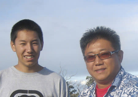 Kenneth Bae, with his son Jonathan, is pictured in this undated family handout photo courtesy of freekennow.com. REUTERS/freekennow.com/Handout