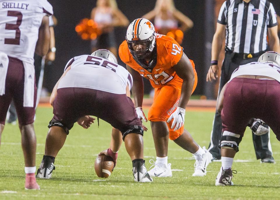 Oklahoma State defensive tackle Jayden Jernigan (42) gets ready for the snap of the ball during a game against Missouri State at Boone Pickens Stadium in Stillwater, Okla.