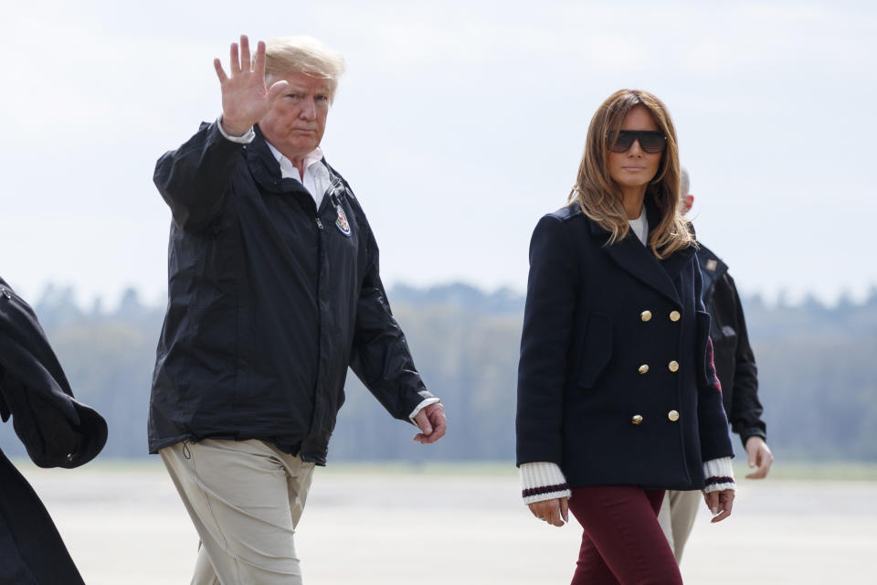 FILE - In this March 8, 2019 file photo, President Donald Trump and first lady Melania Trump walk from Marine One to board Air Force One at Lawson Army Airfield, Fort Benning, Ga., en route Palm Beach International Airport in West Palm Beach, Fla., after visiting Lee County, Ala., where tornados killed 23 people. Trump has had it with the #fakeMelania conspiracy theories circulating on social media. Trump is claiming that photos of his wife were altered to make it appear that a look-alike accompanied him to Alabama last week. (AP Photo/Carolyn Kaster)