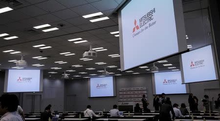 FILE PHOTO: Logos of Mitsubishi Electric Corp are seen at a news conference at the company's headquarters in Tokyo, Japan, May 23, 2016. REUTERS/Toru Hanai/File Photo
