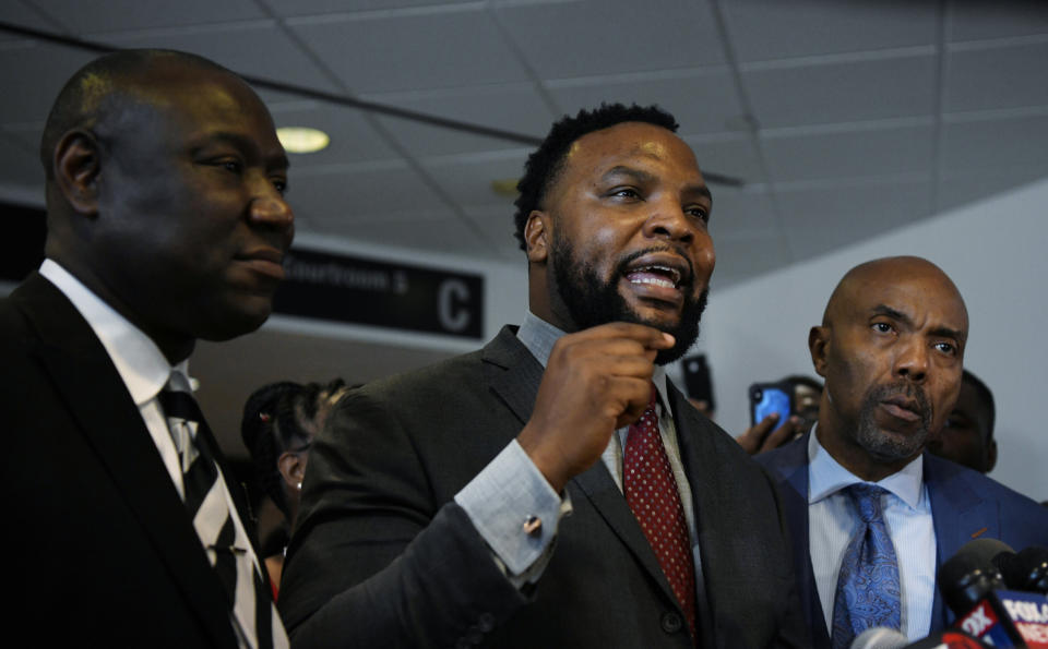 Botham Jean's family attorneys, Benjamin Crump, Lee Merrit&nbsp; and Daryl Washington, address the press after the conviction charge of murder was delivered on Oct. 1. (Photo: Jeremy Lock / Reuters)