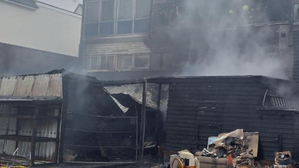 The fire damaged building in Billericay, with smoke billowing