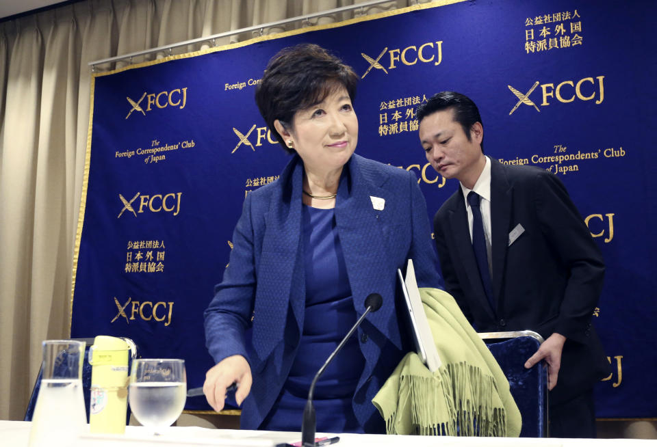 Governor of Tokyo Yuriko Koike arrives for a press conference in Tokyo, Monday, Feb. 18, 2019. Gov. Koike has declined to weigh in on the future Japanese Olympic Committee President Tsunekazu Takeda. Takeda is being investigated for his part in a bribery scandal that French investigators believe may have helped Tokyo win the 2020 Olympics in a vote by the International Olympic Committee.(AP Photo/Koji Sasahara)