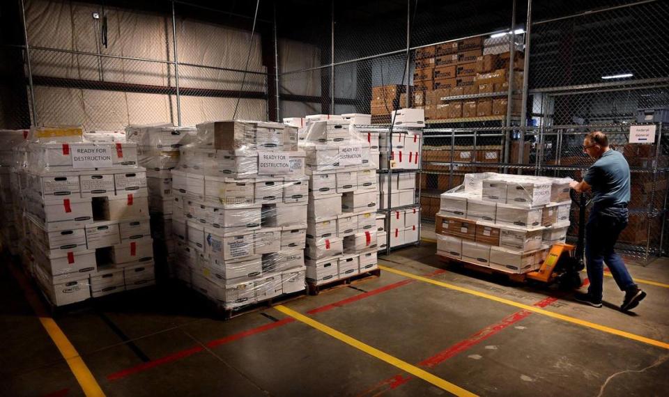 At the Johnson County Election Office, Al Sneller, an employee in the warehouse, moves dozens of boxes into storage that contain ballots, documents and other paperwork from the 2020 general and primary elections, and the August 2, 2022 primary election.