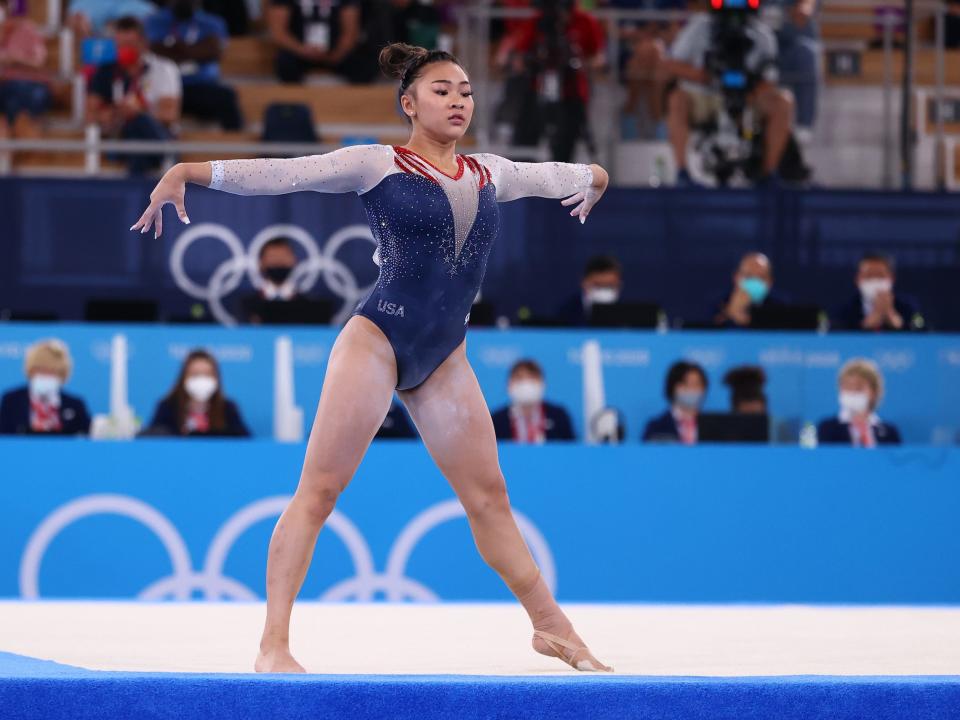 Suni Lee competes on the floor at the Tokyo Olympics.