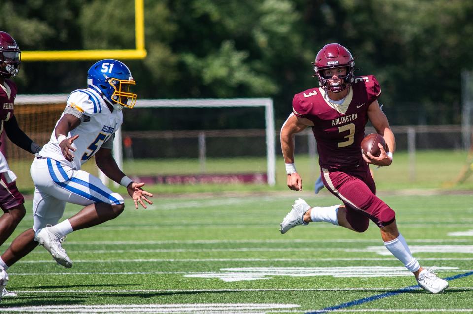 Arlington's Michael Rescigno drives upfield against Kellenberg during a Sept. 2, 2023 football game.