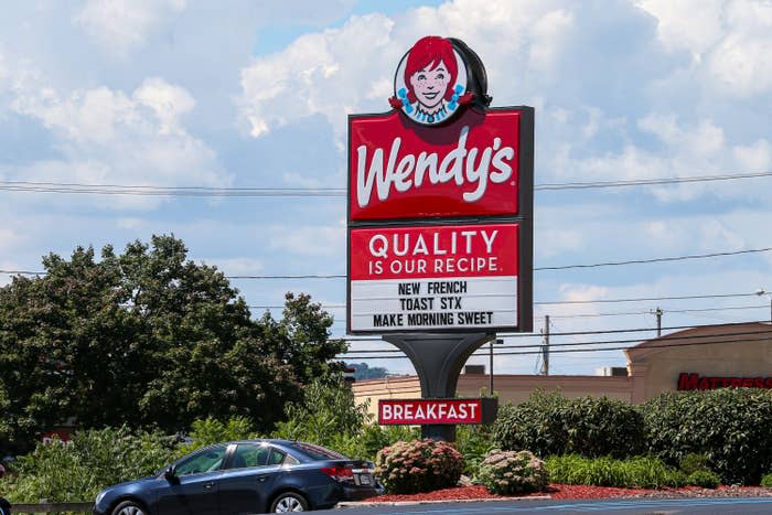 Wendy's store sign saying "Quality is our recipe" and advertising new French toast