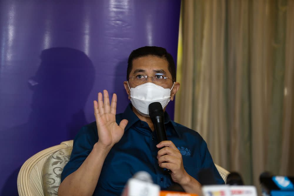 Minister of International Trade and Industry Datuk Seri Azmin Ali speaks to the press during a visit to the Bukit Jawi Golf Resort vaccination centre in Penang June 17, 2021. — Picture by Sayuti Zainudin