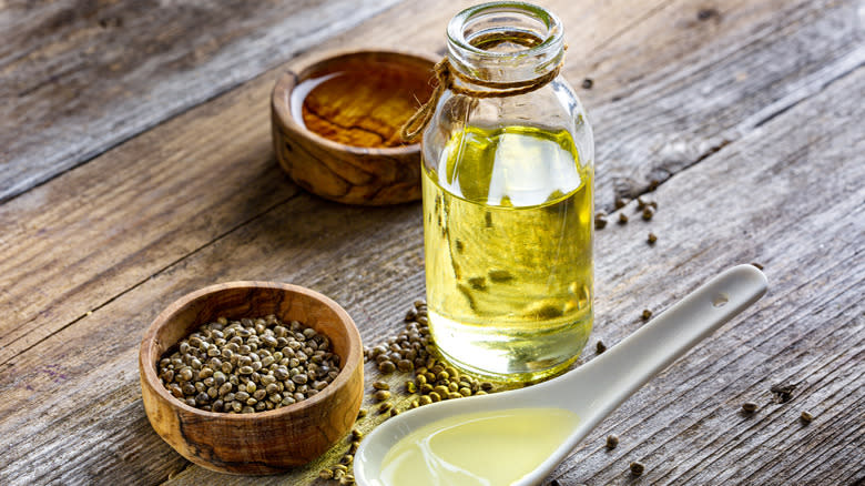 canola oil and spoon on table