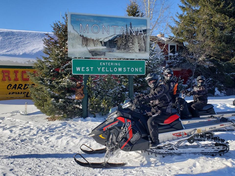 The author on a snowmobile in West Yellowstone, a town near Yellowstone National Park.