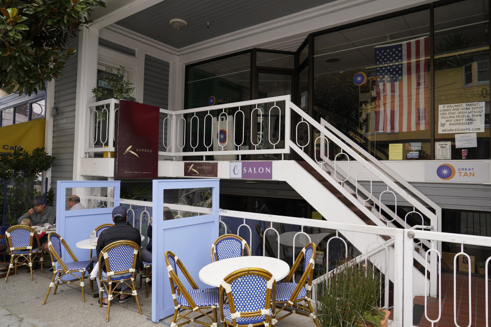 A stairway leads to the entrance of eSalon at top left on Union Street Wednesday, Sept. 2, 2020, in San Francisco. House Speaker Nancy Pelosi is getting heat over a solo hair salon visit in San Francisco on Monday at a time when California businesses are limited by concern over coronavirus. But Pelosi's spokesman said she was complying with the rules as presented to her by eSalon. (AP Photo/Eric Risberg)