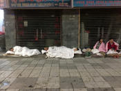 <p>Tourists sleep on a street after an earthquake in Jiuzhaigou county, Ngawa prefecture, Sichuan province, China, Aug. 9, 2017. (Photo: Stringer/Reuters) </p>