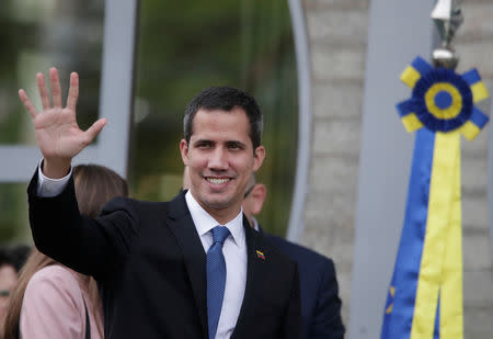 Venezuelan opposition leader Juan Guaido waves as he arrives at the European Union headquarters in Brasilia, Brazil Febbruary 28, 2019. REUTERS/Ueslei Marcelino