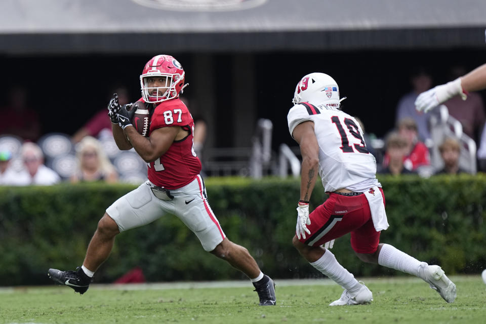 Georgia's Mekhi Mews (87) returns a punt as Ball State's Nick Presley (19) coversin the second half of an NCAA college football game Saturday, Sept. 9, 2023, in Athens, Ga. (AP Photo/John Bazemore)