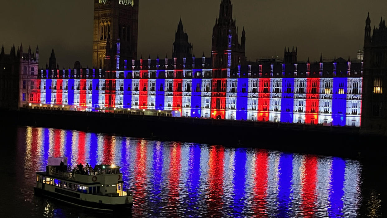  The Palace of Westminster alit in red, blue and white by Cameo lights. 