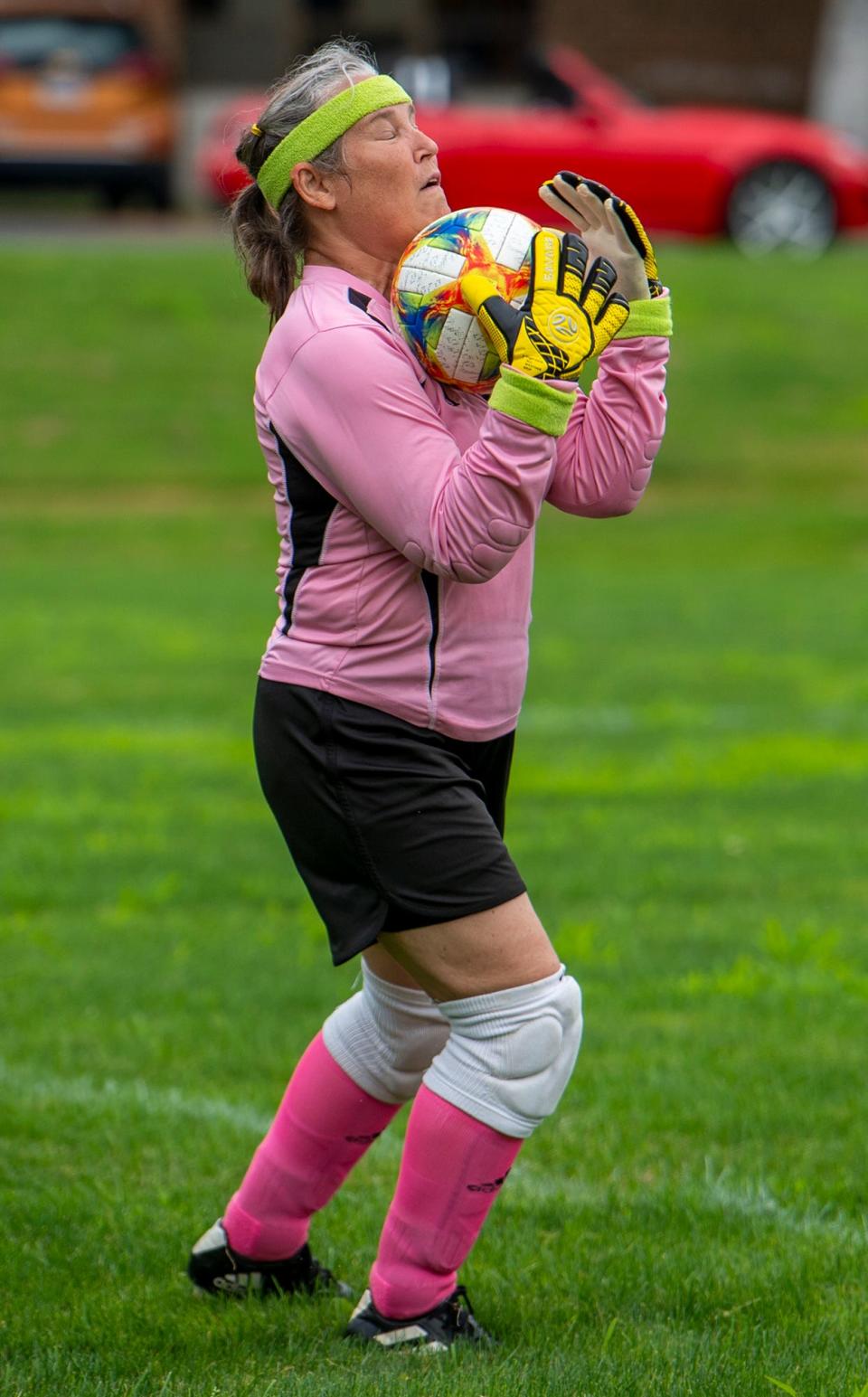 Goalie Chris Matson, of Belmont, makes a save at a Bay State Breakers practice  for women over 50 with some in their 70s at the Brophy School in Framingham, July 21, 2023.