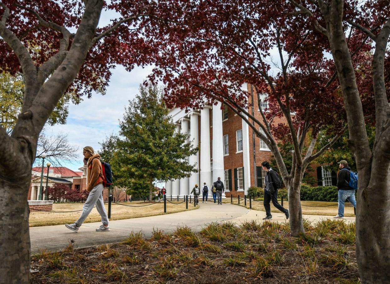 University of Mississippi students walk across campus in Oxford, Miss.