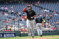 Miami Marlins' Jesus Aguilar celebrates his two-run home run during the first inning of a baseball game against the Washington Nationals, Saturday, July 2, 2022, in Washington. (AP Photo/Nick Wass)