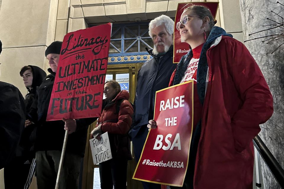 People rally outside the Alaska Capitol, Monday, Jan. 29, 2024, in Juneau, Alaska, in support of increased funding for public schools in the state. The rally was set to take place the night of Gov. Mike Dunleavy's State of the State speech but the speech was delayed until Jan. 30 after high winds disrupted flights carrying speech guests and Cabinet members. (AP Photo/Becky Bohrer)