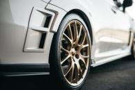 <p>Specially developed Dunlop SP Sport Maxx GT 600A tires that are wider (265s all around versus 245s on the standard STI) on forged BBS 19-inch wheels fill obligatory fender flares.</p>