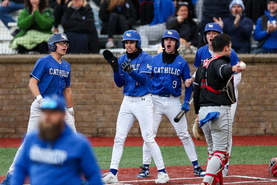 Lexington Catholic players, including Max Daugherty, center, and Tyler Nighbert (9), celebrated after teammate Brady Wasik (15) hit a three-run triple in the bottom of the sixth inning against Manual on Friday. Silas Walker/swalker@herald-leader.com