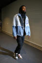 Kyrie Irving wears a Faith Connexion denim jacket and Travis Scott x Air Jordan 1s.