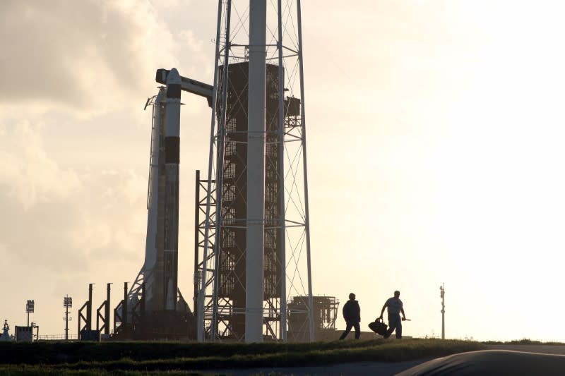 The SpaceX Crew Dragon sits atop a Falcon 9 booster rocket on Pad 39A at Kennedy Space Center before a scheduled in-flight abort test