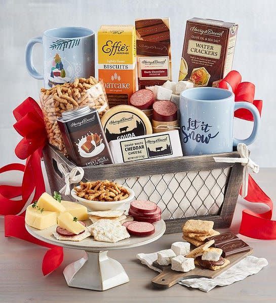 <p>harryanddavid.com</p><p><strong>$119.99</strong></p><p>They'll love cozying up by the fire with this crate filled with sweet and salty treats. It comes with everything you need to make your own s'mores, plus two snow-themed mugs for hot cocoa.</p>