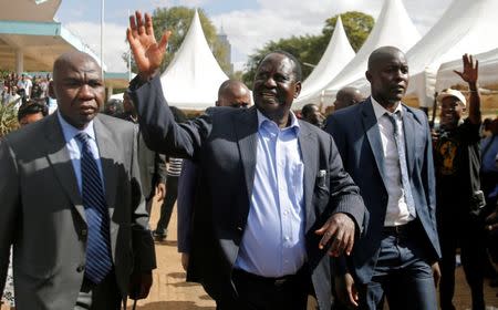 FILE PHOTO: Kenyan opposition leader Raila Odinga is escorted after addressing striking doctors at the Uhuru Park as they wait for the release of jailed officials of the national doctors' union following their case to demand fulfilment of a 2013 agreement between their union and the government that would raise their pay and improve working conditions, in Nairobi, Kenya February 15, 2017. REUTERS/Thomas Mukoya