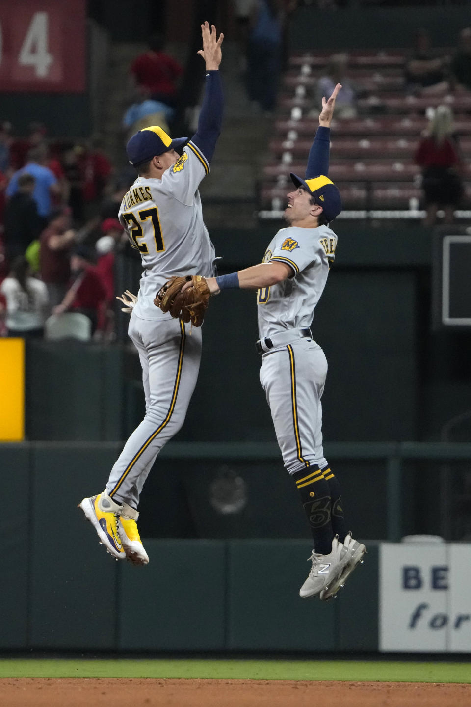 Milwaukee Brewers' Willy Adames (27) and Sal Frelick celebrate a 7-3 victory over the St. Louis Cardinals following a baseball game Tuesday, Sept. 19, 2023, in St. Louis. (AP Photo/Jeff Roberson)