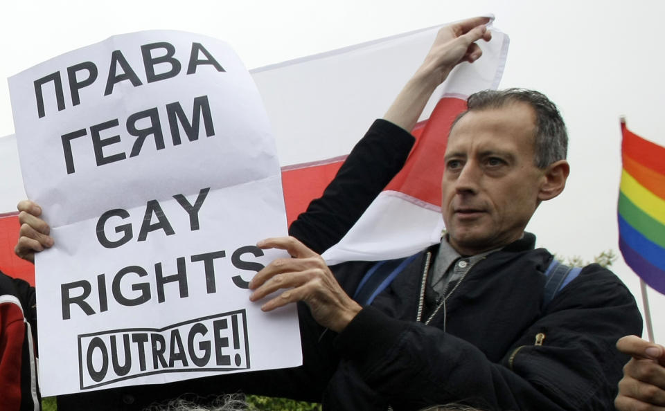 British gay rights activist Peter Tatchell holds a a poster reading "Gay Rights" during a gay rights protest in Moscow, Russia, Saturday, May 16, 2009. Moscow police have violently dispersed a gay pride parade banned by the authorities. Riot police broke up a protest by around 20 gay pride activists, dragging them into detention buses. Activists called Russia's alleged homophobia "a disgrace." (AP Photo/Misha Japaridze)