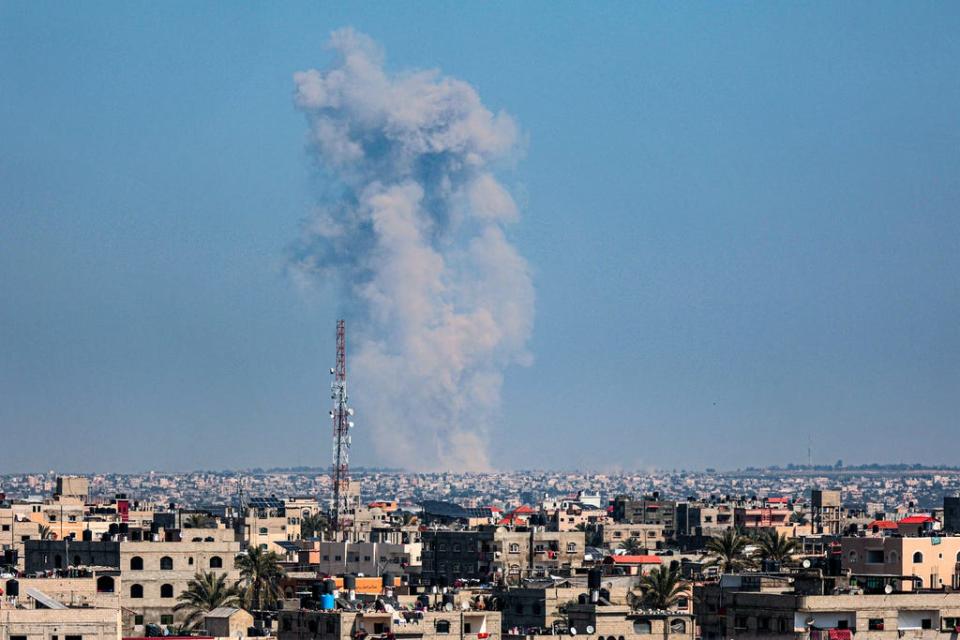 This picture taken from Rafah shows smoke billowing following Israeli bombardment of Khan Younis in the southern Gaza Strip on Feb. 26, 2024.