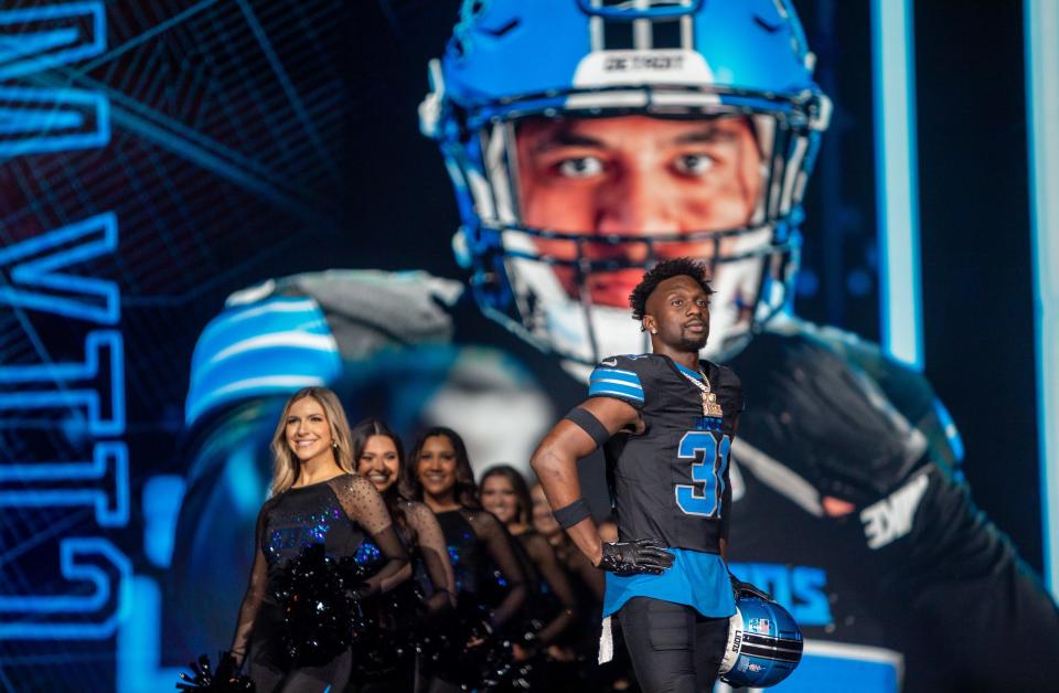 Kerby Joseph (31) walks on stage during the Detroit Lions' new uniform reveal event inside Ford Field in Detroit on Thursday, April 18, 2024.