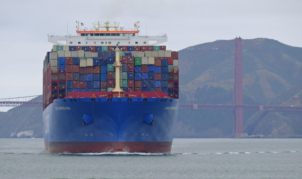 In this photo taken Tuesday, May 14, 2019, a container ship passes the Golden Gate Bridge in San Francisco bound for the Port of Oakland. Federal officials are promoting a campaign to get ships to slow down as they approach San Francisco and other California ports so they are less likely to injure or kill whales. The San Francisco Chronicle reported Friday, May 17, 2019, marine experts say four of the 10 gray whales found dead near San Francisco this year were killed by ships. (AP Photo/Eric Risberg)