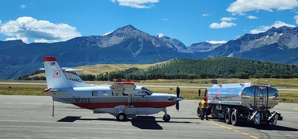 The aerial survey crew fuels its aircraft on an airstrip in Telluride before taking to the skies to survey insect and disease damage to forests.