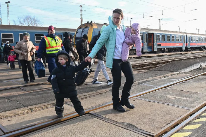 Refugees arrive from Ukraine at the railway station in the Hungarian-Ukrainian border town of Zahony on March 1, 2022.