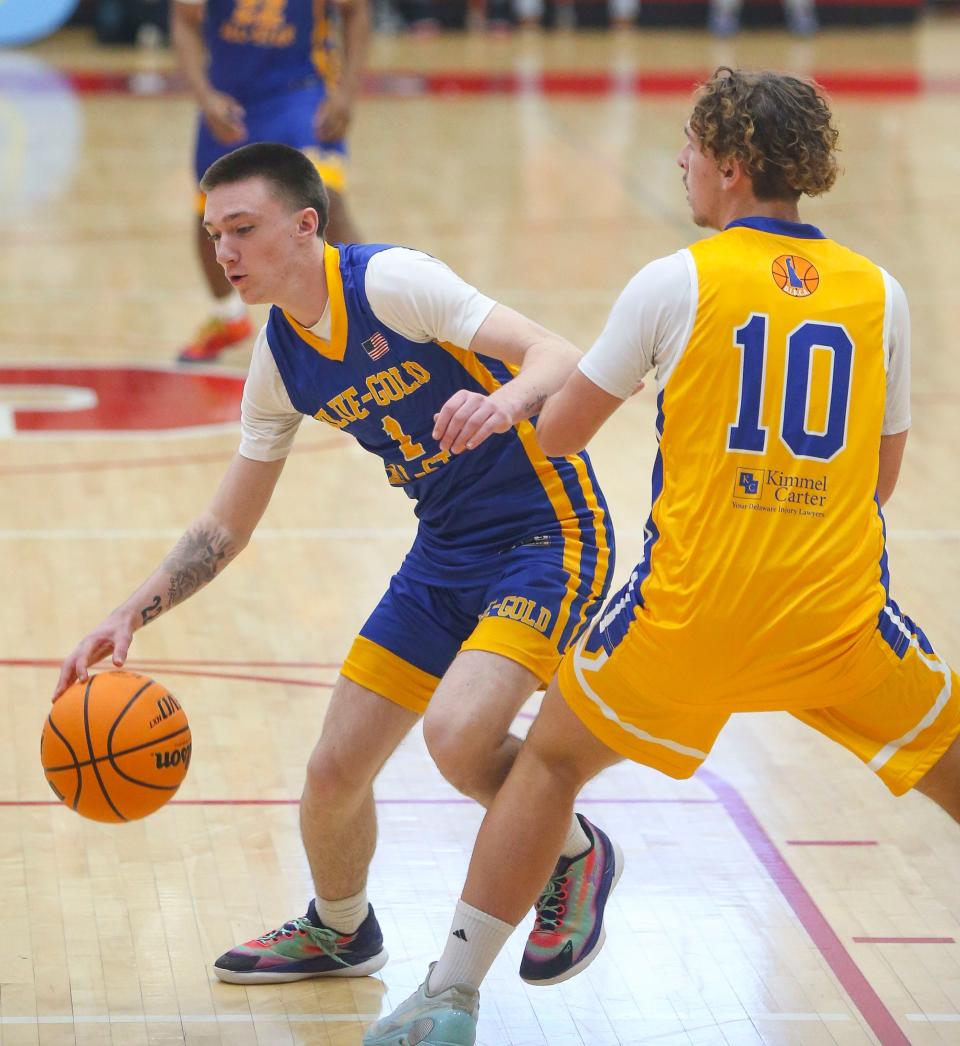 Blue's Gabe Swift of Delaware Military (left) works against Gold's Jackson Starkey of Lake Forest in the Blue-Gold All Star high school senior game at Smyrna High School, Saturday, March 16, 2024. The game benefits the Delaware Safety Council and the Delaware Interscholastic Basketball Coaches Association (DIBCA) scholarship fund.