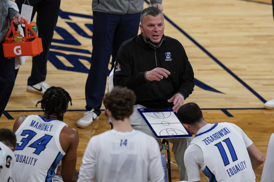 Creighton head coach Greg McDermott talks to his team during the first half of an NCAA college basketball game against the Butler in the Big East conference tournament Thursday, March 11, 2021, in New York. (AP Photo/Frank Franklin II)
