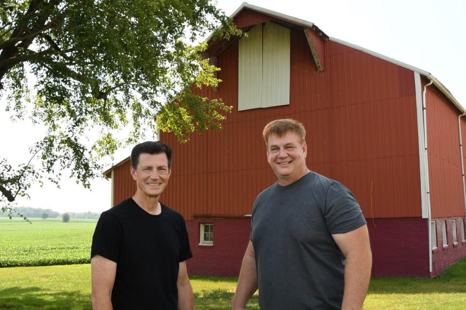 Brothers and Co-Founders Jeff (left) and Steve (right) Kavanaugh standing outside of their family farm located in Daviess County.