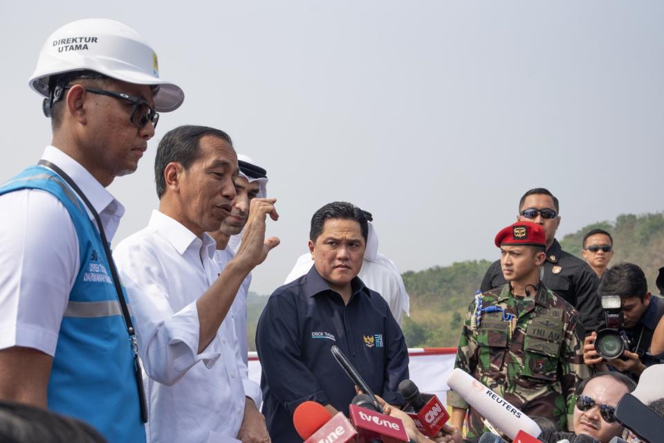 Jokowi, second left, with Erick Thohir, center, at the inauguration of a photovoltaic power plant in Purwakarta, Indonesia, in November 2023.