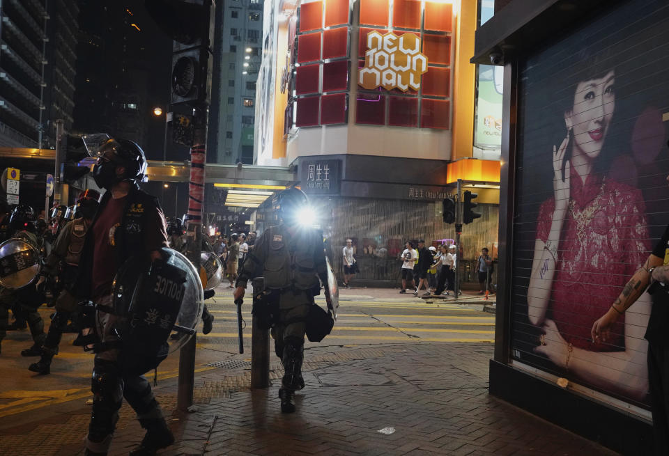 Hong Kong police officers patrol Hong Kong on Sunday, Oct. 27, 2019. Hong Kong police fired tear gas Sunday to disperse a rally called over concerns about police conduct in monthslong pro-democracy demonstrations, with protesters cursing the officers and calling them "gangster cops." (AP Photo/Vincent Yu)